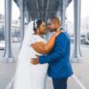 Elegant wedding couple embracing on a Paris bridge, symbolizing love and togetherness.
