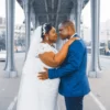 Elegant wedding couple embracing on a Paris bridge, symbolizing love and togetherness.