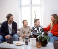 a group of people sitting around a table