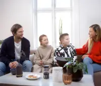 a group of people sitting around a table
